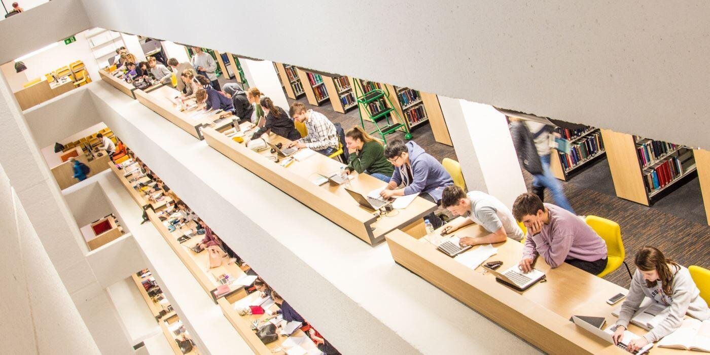 People working on the Edward Boyle Library benches