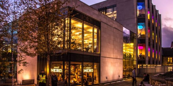 Laidlaw Library lit up at dusk