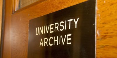 The entrance plaque on the University Archive door
