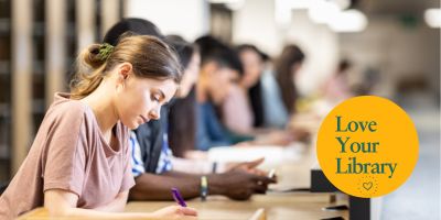 Students study In Edward Boyle Library. The Love Your Library Logo is in the right corner.