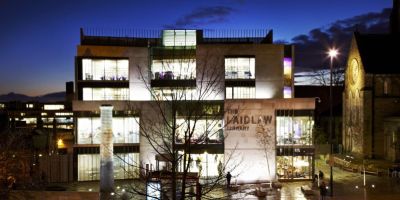 Laidlaw Library lit up at night.