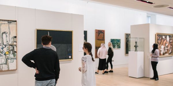 Visitors looking at artwork in The Stanley and Audrey Burton Gallery