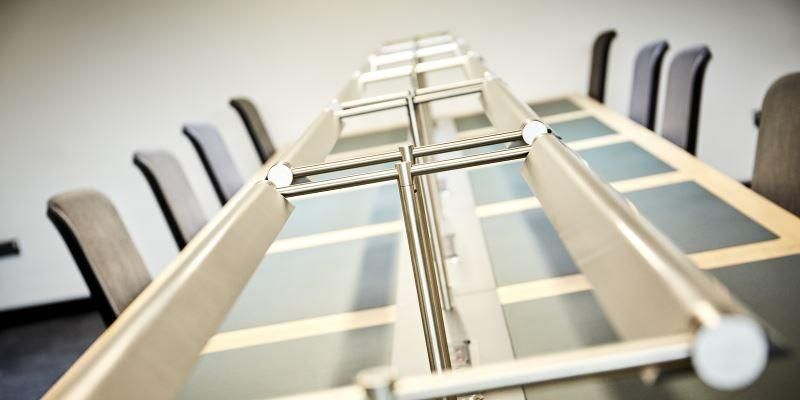 An image of desks with individual desk lamps